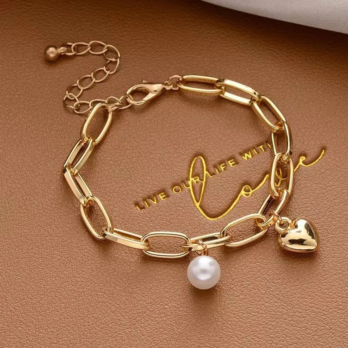 women's gold bracelets-Simple Style Cross Heart Shape Artificial Pearl Alloy Plating Gold Plated Women'S Bracelets