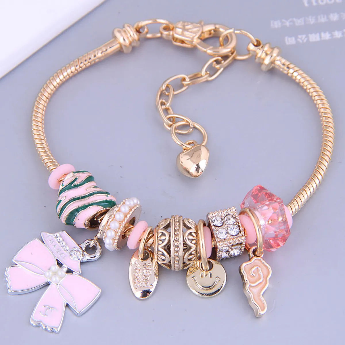 women's cuff bracelets-Fashion Gold Metal Simple Bow Multi-Element Pendant Bracelet